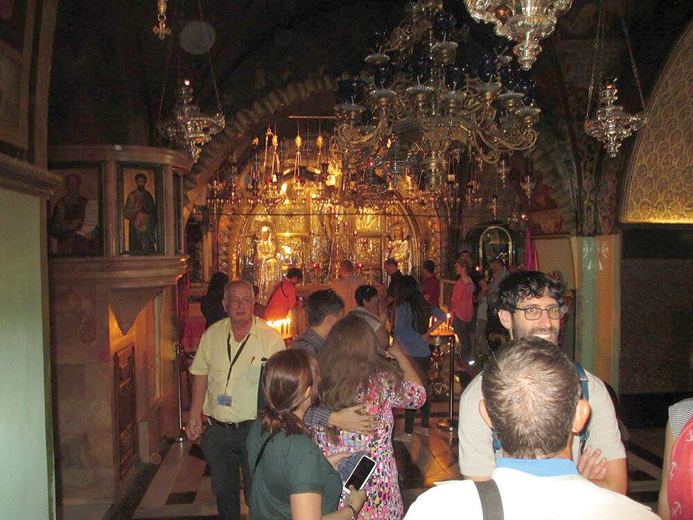 Pilgrims and tourists before the altarWEB.jpg